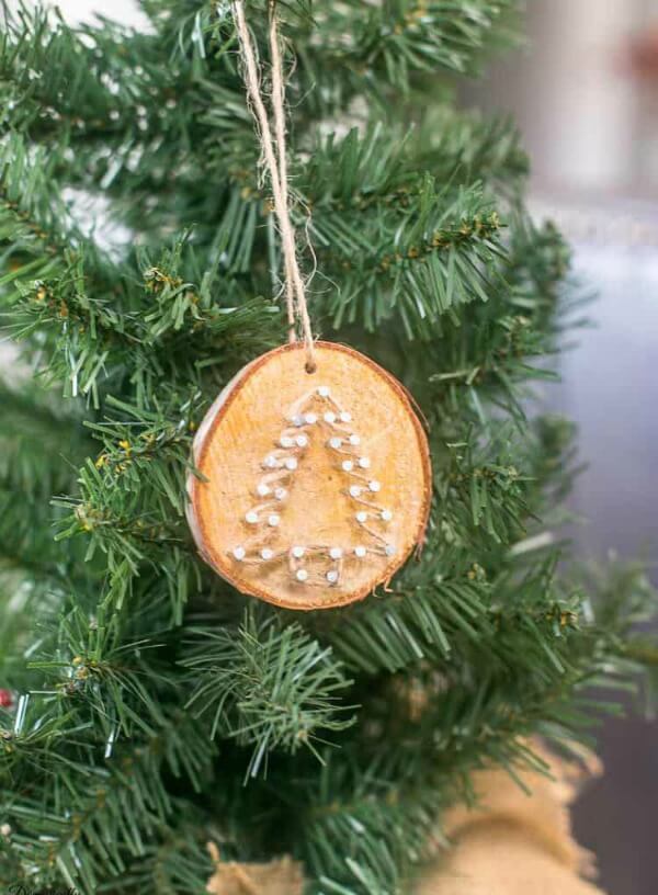 Hand-drawn Christmas ornament with natural materials like leaves and twigs