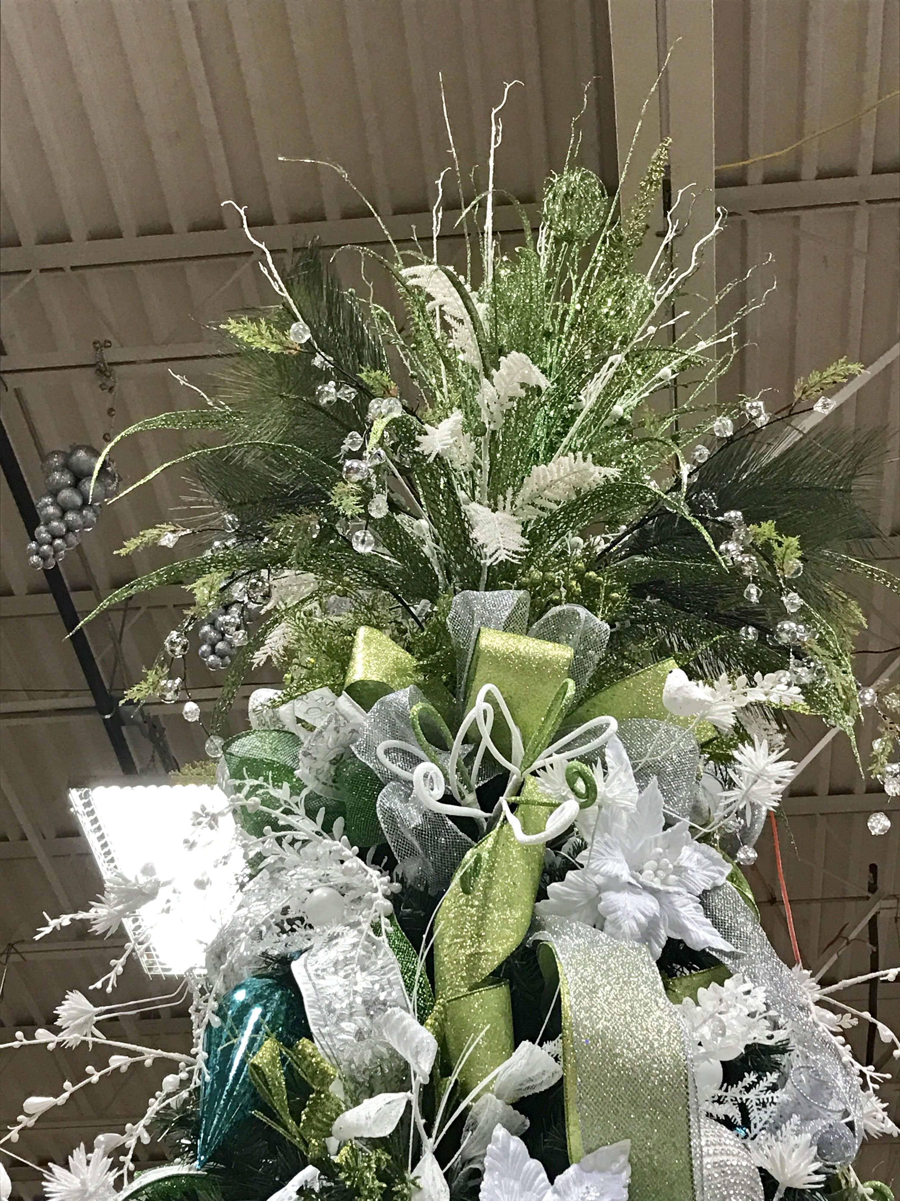 Green Christmas tree with a tree topper