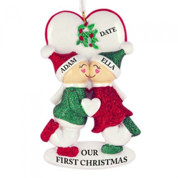 A loving couple under mistletoe ornament