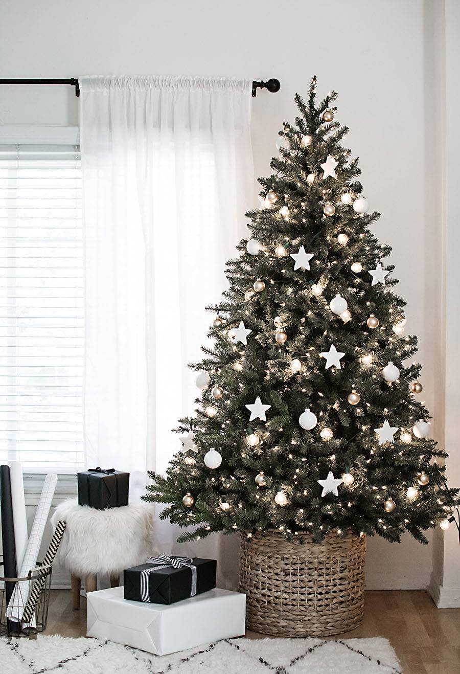 Monochromatic Christmas tree base with ornaments and ribbons