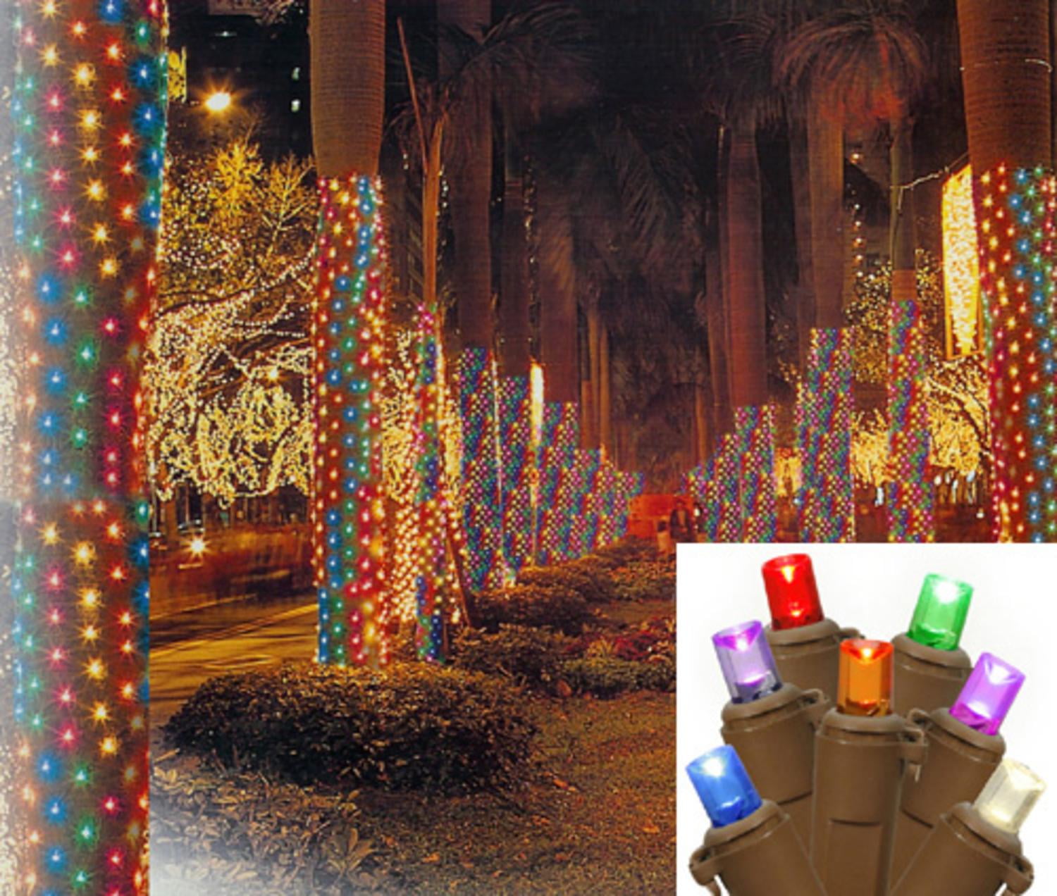 Wrap and tuck Christmas lights around the tree trunk